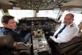 Business, economy premium and economy. Photo Boeing 777 200er Aircraft Cockpit Unian