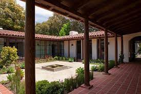 The area around the pool and its fencing are finished with a terrace board. Historic Adobe Modern Architecture Remodelista Courtyard House Plans Modern Adobe House Spanish Style Homes