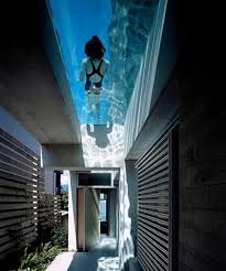 Cool Concrete House With Hot Swimming Pool Feature Above Main Entrance