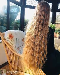 image may contain 1 person plant long hair styles extremely long hair very long hair