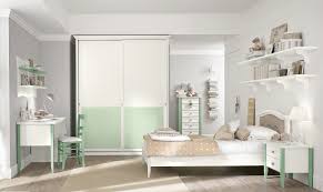 Incorporate elegant pieces like a white plush foot stool, soft curtains, and a mirrored dresser. Modern Bedroom Design Ideas For Girls