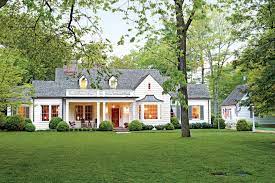 For more classically styled homes, white is a traditional accent for window trim, pillars, and doors. Best Exterior Makeover Southern Living