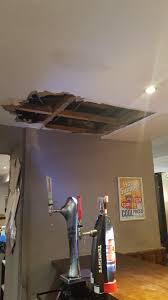 For example, a damp patch on the wall at the top of a chimney breast suggests a leak from the chimney stack, a wet patch at the top of a wall may indicate a leaking gutter and damp near windows might mean a damaged drip groove beneath the window sill. Small Damp Patch In Ceiling The Manager Decides To Poke It For Fun Who Wants Plaster And Asbestos In Their Pint Bartenders