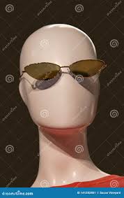 Featureless Mannequin Head with Sunglasses and an Orange Tee-shirt Against  Black Background Stock Image