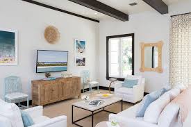 Knowing how to use decorative ceiling beams properly can make for a wonderful interior design. White And Blue Beach Cottage Living Room With Black Wood Ceiling Beams Cottage Living Room