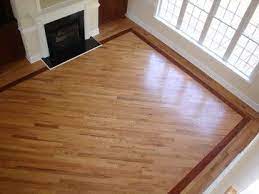 Rustic floors don't need to be dark to make a statement. Strong And Reliable Hardwood Flooring Installation Hardwood Flooring Designs Hardwood Floors With Borders Wood Floor Design Wood Floors Wide Plank Floor Design