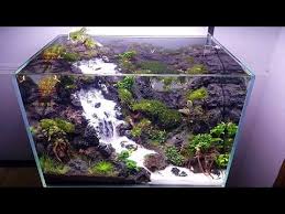 This Aquarium Has A Working Waterfall Inside And It S Sort Of Melting My Brain Aquascape Design Planted Aquarium Aquarium Landscape