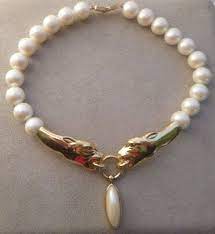 Reserved Vintage Givenchy Pearl Choker With Golden Panthers Etsy Vintage Givenchy Vintage Givenchy Jewelry Givenchy Necklace