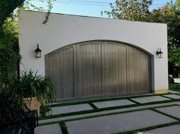 Our spanish and craftsman wood doors collection incorporates handcrafted wood check out the best garage doors to fit your industrial style. Artesia Spanish Style Custom Wood Garage Door Lux Garage Doors