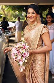 14 Charming Brides Who Dazzled In A Saree On Their Wedding Day Christian Bridal Saree Kerala Wedding Saree Christian Wedding Sarees