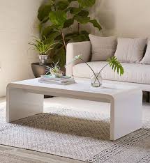 This table's slim and playful silhouette is suitable for small spaces. Minimalist Narrow Coffee Table 15 Narrow Coffee Table Ideas For Small Spaces Narrow Coffee Table Coffee Table Coffee Table Design Modern
