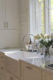 Off white kitchen cabinets with white marble countertops and. How To Choose The Right White Quartz For Kitchen Countertops Hello Lovely