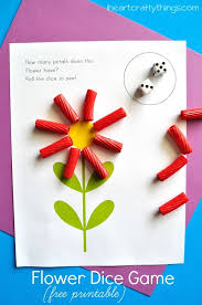 Provide different kinds of pompoms (spiky, glitter). Preschool Math Activity Flower Dice Game Printable Math Activities Preschool Preschool Math Games Flower Math
