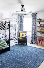 Boys room in blue color and toy. A Boy S Room Makeover With A Super Hero Theme Shades Of Blue Interiors