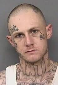 Man with 'hate' tattoo across throat sought by police