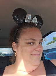 On my way to Disney with my new ears and earrings.