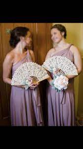 The display can be further embellished with paper fans, garlands, or flowers (use silk ones, since real flowers won't hold up on a moving automobile). Pin By Laura Ricci On Bridesmaids Bridesmaid Bouquet Alternatives Unique Wedding Bouquet Alternative Bouquet