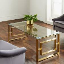 This table's circular shape fits conveniently into all sorts of spaces within your home. Modern Gold Stainless Steel Metal Clear Glass Top Coffee Table All Home Living
