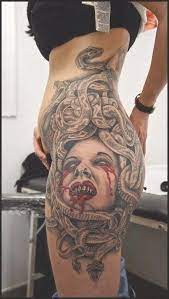The floral design is pretty but the location makes it a badass tattoo. 45 Unreal Badass Tattoos Designs Inkdoneright Girl Tattoos Medusa Tattoo Side Tattoos