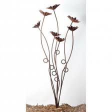 These colorful metal blooms are made by cutting recycled cans and discarded items, then artists design them into yard art and special products ready to decorate your home and lawn. Metal Flower Garden Sculptures Poppies Roses Gerberas Black Country Metalworks