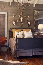 Natural elements, like fresh flowers and a driftwood lamp, complement the leather's smooth grain. Are Deer Heads Antlers In Decor Tacky Yes Or No