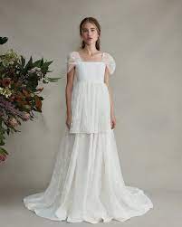 6 Cool Wedding Dress Brands For The Nontraditional Bride Who What Wear Wedding Dress Brands Unusual Wedding Dresses White Lace Gown