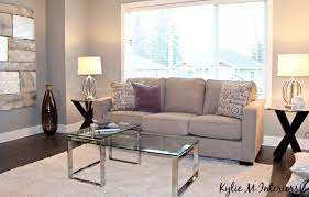Living Room Home Staging Ideas With Glass Chrome Gray Walls With Purple Undertone And Dark Laminate Wood Flooring Kylie Home Staging Home Staging Tips Home