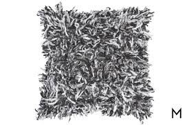 The sham is framed in a rich, green border with black accents. Charcoal Shag Pillow