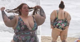 tess holliday slays in low cut swimsuit amid piers morgan