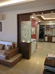 Wheeled partitions in large halls allow for the creation of microenvironments—smaller areas and comfortable nooks interspersed in the space to. Drawing Room And Dining Room With Wooden Glass Partition Modern Luxury Design False Ceiling Living Room Living Room Partition Room Partition Designs