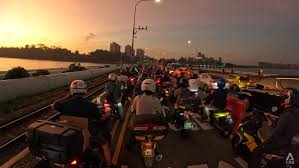 Causeway traffic during sunrise showing stress working in Singapore from Johor Bahru
