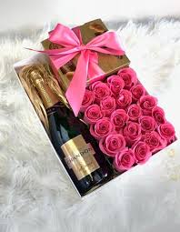 I am looking to send a bottle of wine and some balloons to my partner in usa. Roses Champagne And Chocolate Gift Box Local Florist Miami Wine Gift Box Ideas Flower Box Gift Wine Gifts