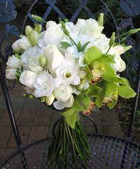 Bridal Bouquet Of Green Cymbidium Orchids White Roses And Freesia Orchid Bridal Bouquets White Wedding Flowers Wedding Flowers