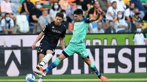 The traditional team home kit is black and white striped shirt, black shorts, and white socks. Ryw5yq2oija40m