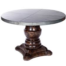 Made of solid wood with veneer. Fredrick Wood Base Dining Table With 54 Round Hammered Zinc Top