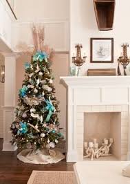 Decorate your coastal themed christmas tree with blue shades, silver ornaments, and a burlap garland. 73 Coastal Christmas Ideas Coastal Christmas Beachy Christmas Beach Christmas