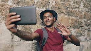 Happy african american tourist man having online video chat using tablet  computer while travelling in Europe | Video online, Europe travel, Video  chatting