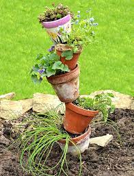 Tilted flower pots, also known as welcome pots, are great statement pieces around entry ways and gardens. Make This Leaning Tower Of Pots It S Easy When You Know The Secret Buffalo Niagaragardening Com