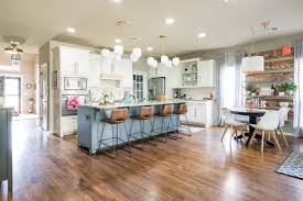 The first kitchen combines natural oak with painted oak cabinets in a dark moody blue color How To Decorate An Open Floor Plan 7 Design Tips
