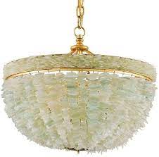 Beach chandeliers are often soft and airy, made of materials such as wood and shell, to invite a sense of calm into your home. Sea Glass Elegance Coastal Chandelier Nautical Luxuries