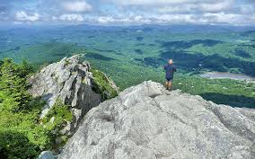 At an altitude of 5964 ft, calloway is the highest peak in the park, on the mountain, and in the blue ridge range, and rises nearly a mile above the piedmont region below. Grandfather Mountain Mile High Swinging Bridge