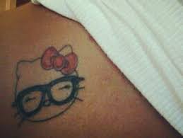Outline stars and kitty and kitty tattoo on back. 15 Cute Lovely Hello Kitty Tattoo Designs