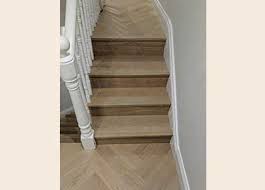 The Herringbone Pattern Is Perfectly Aligned On Each Landing The Steps Have Been Clad In Oak Boards In The Same F Stairs Cladding Flooring Floor Installation