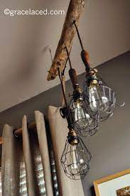 The feiss matrimonio one light mini pendant in driftwood / dark weathered zinc supplies ample lighting for your daily needs, while adding a layer of today's style to your home's decor. Diy Driftwood 3 Light Pendant With Anthropologie Caged Lights Gracelaced