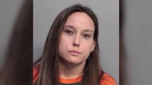 Video shows Florida police officer punch woman in face at football game