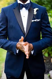 This Groom Wore A Navy Burberry Tuxedo With Satin Lapels Paired With An Eton Formal Shirt With A Pl Mens Beach Wedding Attire Navy Blue Groom Wedding Suits Men