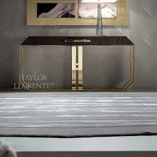 Amazing gallery of interior design and decorating ideas of black and gold console table in bedrooms, living rooms, dens/libraries/offices, dining rooms a black striped runner sits in a foyer in an entry in front of a woven console table fitted with a glass top, styled with a gold and black picture light, and. Gold Console Table Luxury Designer Consoles Taylor Llorente Furniture
