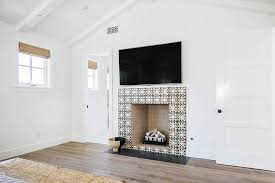 Extra wide fireplace ignites the senses; Black And White Mosaic Fireplace Tiles Transitional Bedroom