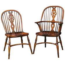 Their straight legs are supported by additional horizontal elements for better stability. Custom Set Of Eight Windsor Wheel Back Chairs 2 Arms And 6 Sides For Sale At 1stdibs