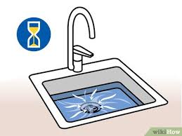 clear a clogged drain with vinegar